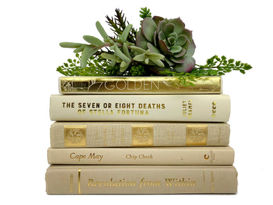 cream and gold decorative books by color
