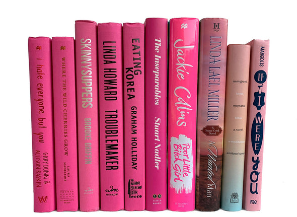 Pink decorative books. Color-coded book stack by the shelf foot.