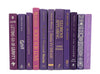 Purple decorator books. Color-coded book stack by the shelf foot.  Edit Your Home Decor.