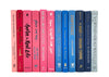 Pink and blue decorator books. Color-coded book stack by the shelf foot. 