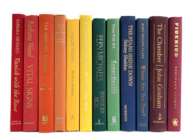 Raiunbow decorator books. Color-coded book stack by the shelf foot.  Edit Your Home Decor.