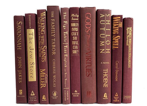 Gold foil lettered maroon decorative books. Color-coded book stack.